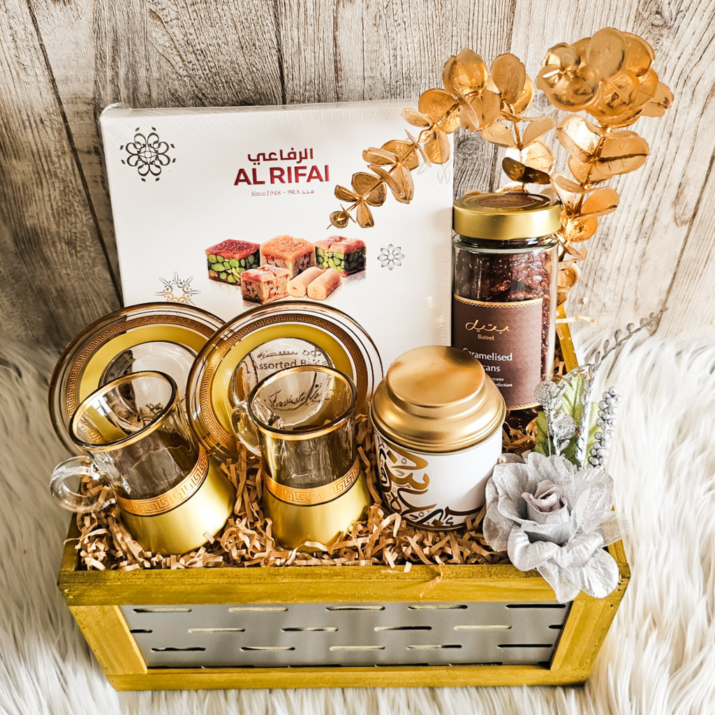 Elegant Eid gift basket beautifully arranged with gourmet treats, including caramelized pecans and traditional Arabian coffee.