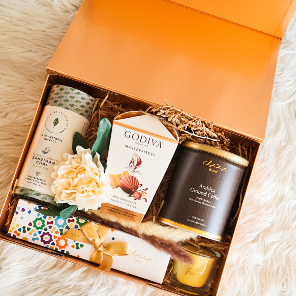 Premium Gift Box featuring Bateel coffee, filled dates, scented candle, Godiva chocolates, and Zanzibar chai.